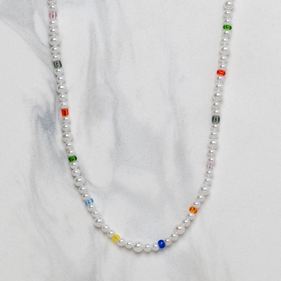 Our Multicolored Asymmetric Pearl Necklace has been crafted using different sized polished white pearls, colored beads and the finest silver hardware to hold it all together.